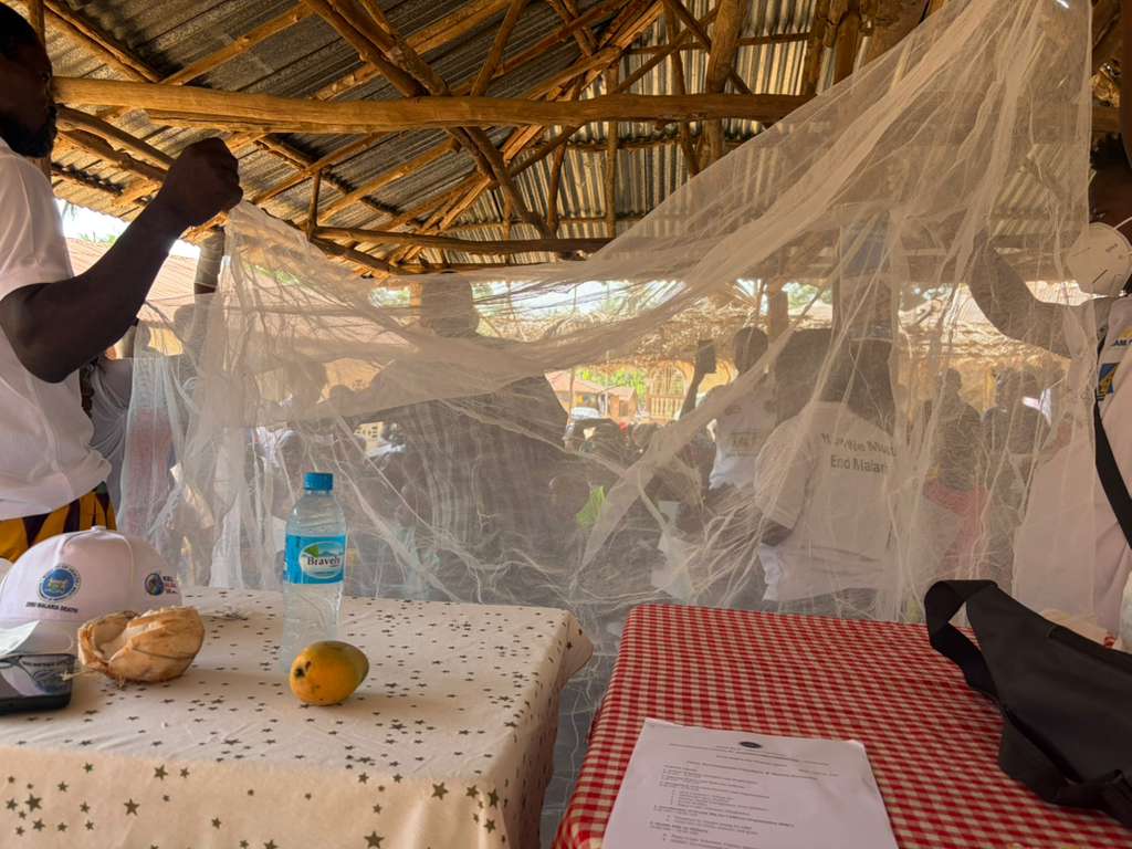 Community members learning about malaria prevention